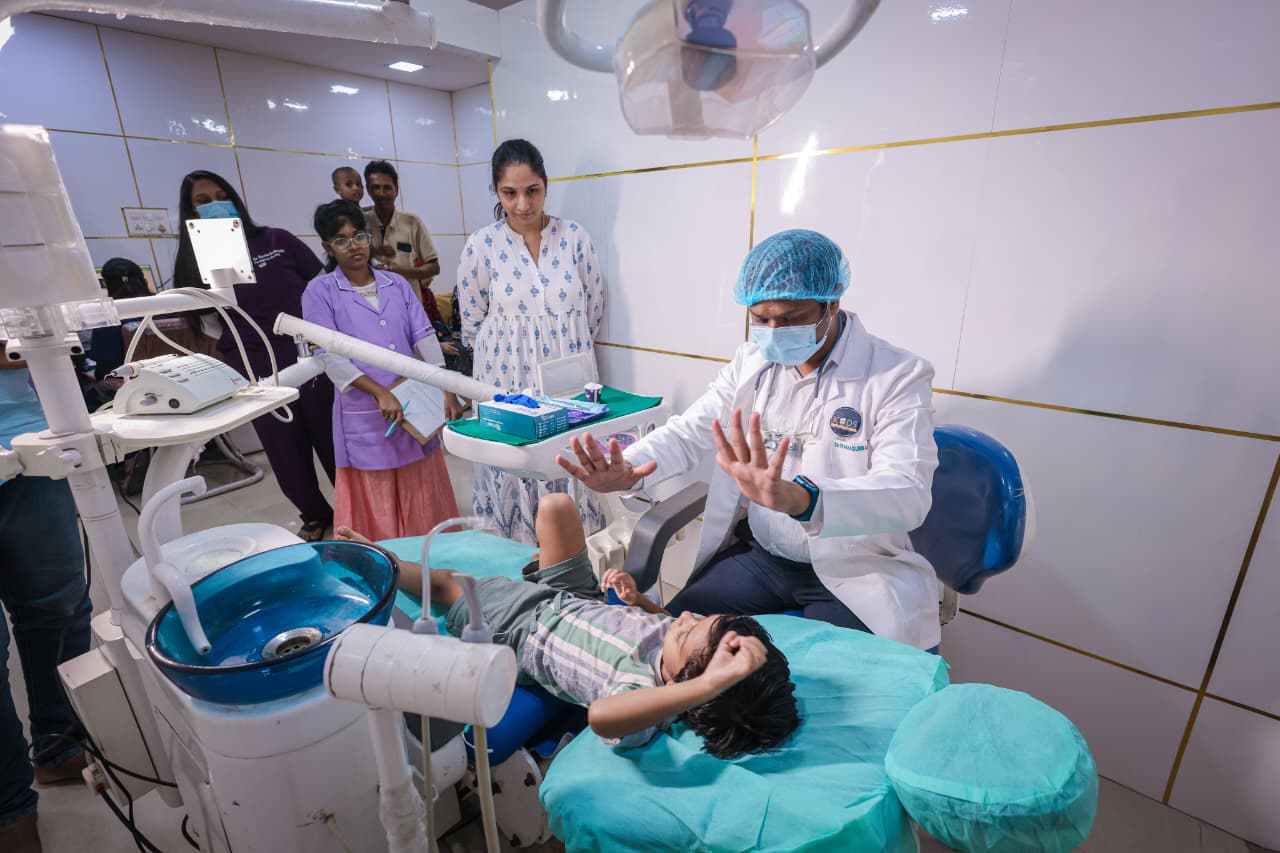 Dr. Ramasubbareddy treating a child